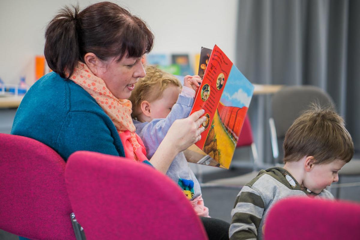 Mother reading with her young child