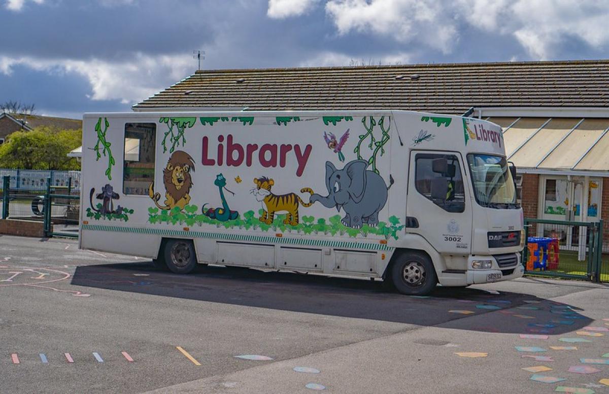 A mobile library vehicle decorated with cartoon animals