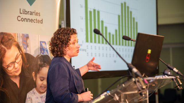 Women presenting at a lectern