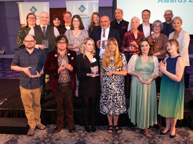 Libraries Connected Award winners pose with their trophies.